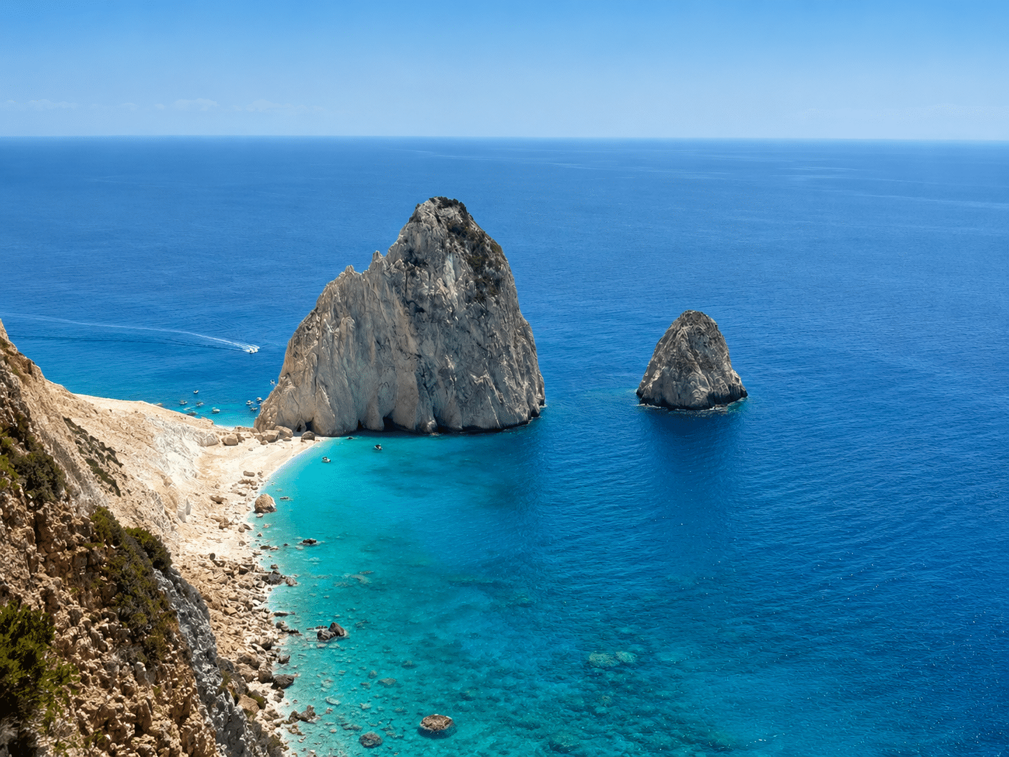 Boat approaching the iconic Mizithres Rocks on the Marine Park Extended tour