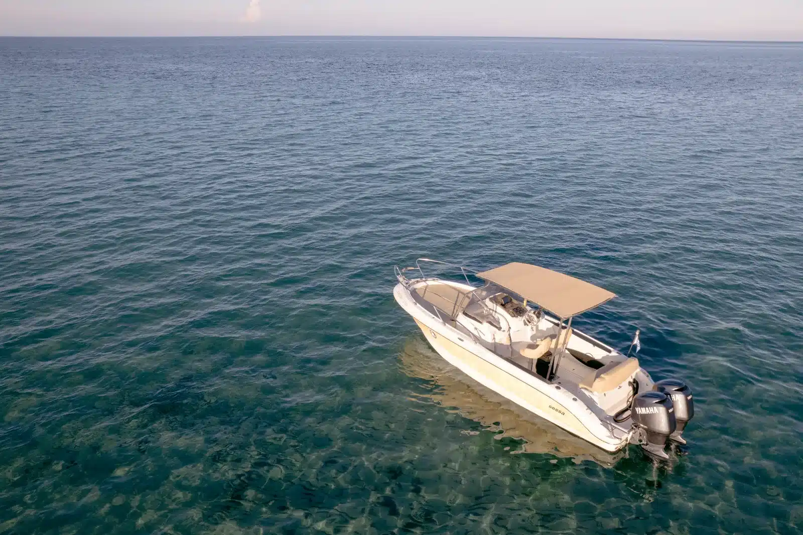 Private charter boat passing the rocky Zakynthos coast
