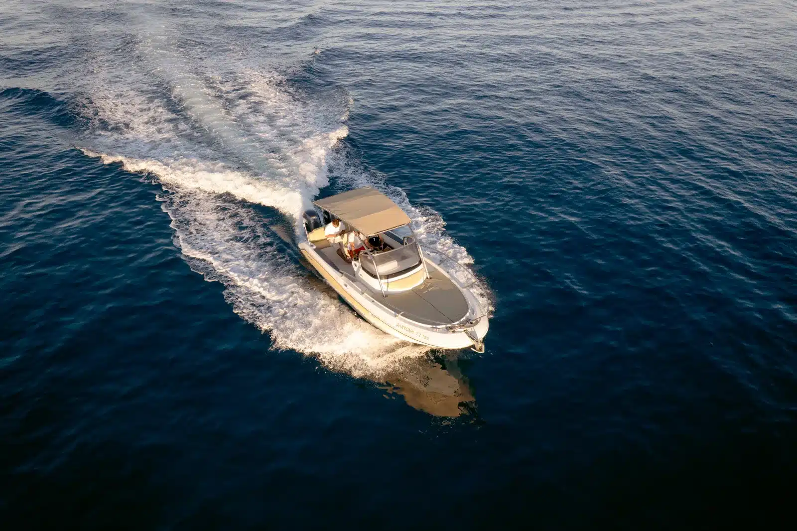 Private charter boat cruising along the blue Ionian coast of Zakynthos