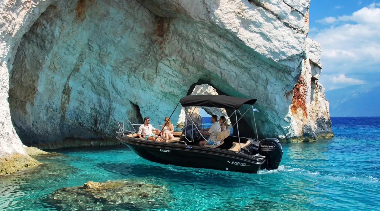 Rental boat inside the electric-blue waters of the Blue Caves, North Zakynthos